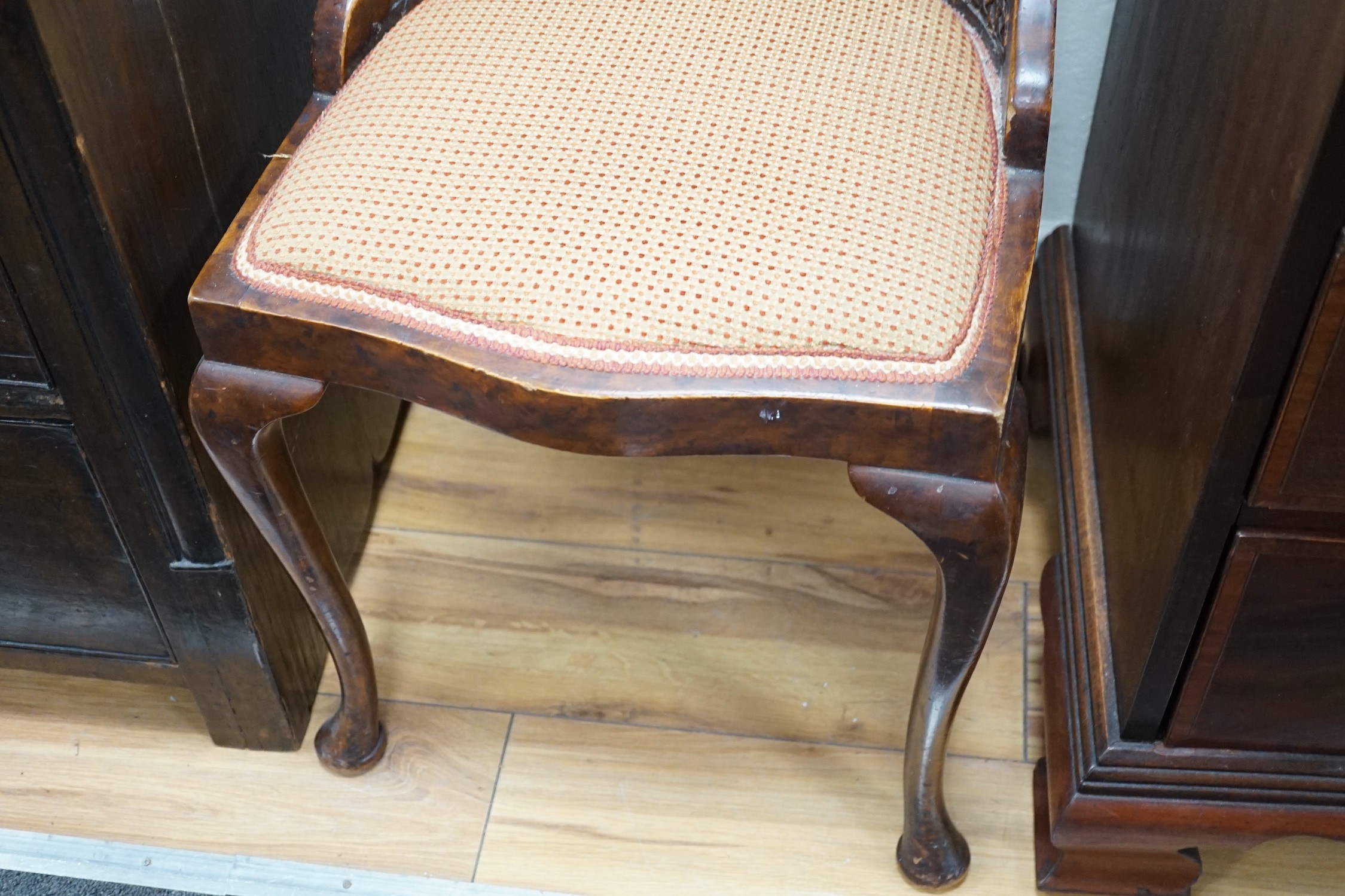 An Edwardian mahogany nursing chair and a 1930's caned walnut occasional chair